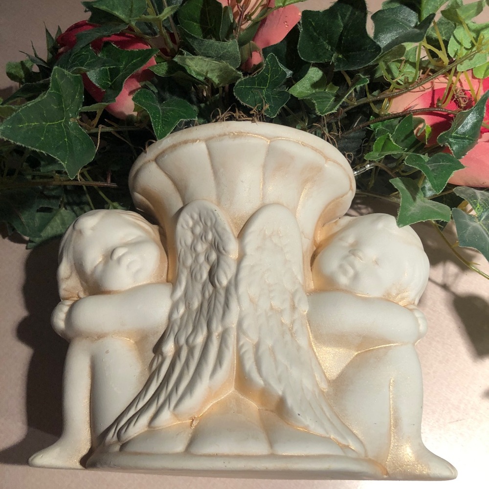 Pottery material angel statue. Ivory with rose gold shimmering accents.